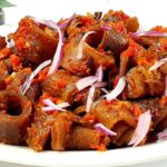 Kpomo in peppered sauce
